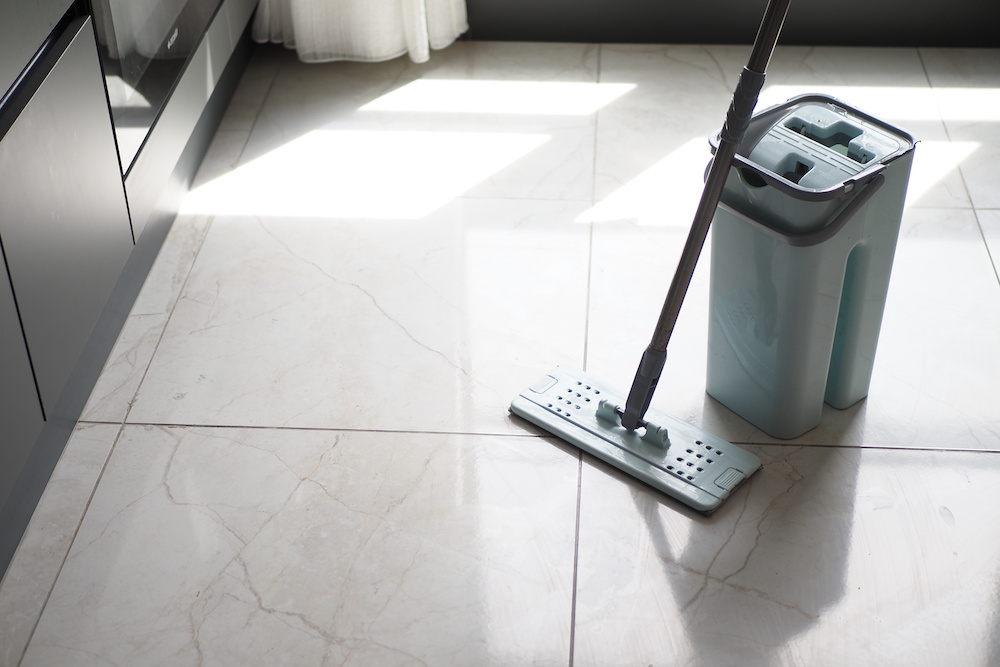 Cleaning tile floors with a mop